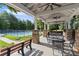 Covered pavilion area with dining seating overlooking community tennis courts and green space at 4085 Tritt Homestead Dr, Marietta, GA 30062