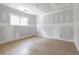 Bright bedroom displaying hardwood floors, primed walls, and natural light through a window at 6010 Fieldcrest Dr, Morrow, GA 30260