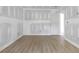 Spacious bedroom boasting new hardwood floors, freshly primed walls, and modern electrical outlets at 6010 Fieldcrest Dr, Morrow, GA 30260