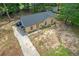 Charming single-story brick home featuring a new roof and front yard at 6010 Fieldcrest Dr, Morrow, GA 30260