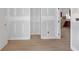 Hallway with newly installed wood flooring and primed walls, offering a blank canvas at 6010 Fieldcrest Dr, Morrow, GA 30260
