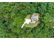 Aerial view of the house showing the extensive wooded property and driveway entrance at 6020 Cochran Mill Rd, Palmetto, GA 30268