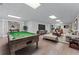 Finished basement featuring a billiard table, entertainment area, and comfortable seating at 6020 Cochran Mill Rd, Palmetto, GA 30268