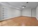 Finished basement with neutral walls, ceiling fan, and built-in shelving, great for entertaining at 6020 Cochran Mill Rd, Palmetto, GA 30268