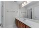 Bathroom featuring a single sink vanity, a large mirror, and neutral colors at 6020 Cochran Mill Rd, Palmetto, GA 30268
