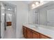 Bathroom featuring a vanity with a sink, a large mirror, and access to additional bathrooms at 6020 Cochran Mill Rd, Palmetto, GA 30268