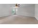 Spacious bedroom with neutral walls and carpet, ceiling fan, and natural light from two windows at 6020 Cochran Mill Rd, Palmetto, GA 30268