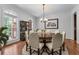 Elegant dining room featuring hardwood floors, a large window, and stylish chandelier at 6020 Cochran Mill Rd, Palmetto, GA 30268