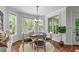 Cozy dining room with a round table, chairs, and a large window with natural light at 6020 Cochran Mill Rd, Palmetto, GA 30268