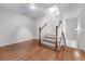 Staircase with hardwood floors and carpeted stairs leading to another floor at 6020 Cochran Mill Rd, Palmetto, GA 30268