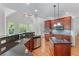 Well-appointed kitchen featuring granite countertops, stainless steel appliances, and modern lighting at 6020 Cochran Mill Rd, Palmetto, GA 30268