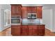Kitchen area featuring stainless steel appliances, granite countertops and wooden cabinets at 6020 Cochran Mill Rd, Palmetto, GA 30268