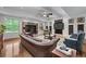 Inviting living room with stylish furniture, fireplace, and large windows offering ample natural light at 6020 Cochran Mill Rd, Palmetto, GA 30268