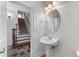 Elegant powder room featuring a pedestal sink and decorative mirror at 6020 Cochran Mill Rd, Palmetto, GA 30268