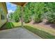 View of the home's backyard featuring a concrete patio and landscaped yard with privacy fence at 622 Denali Dr, Mableton, GA 30126