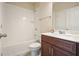 Well-lit bathroom showcasing a white subway tile surround, a modern vanity, and neutral walls at 622 Denali Dr, Mableton, GA 30126
