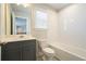 Bathroom featuring a subway tile surround, modern vanity, and a neutral color palette at 622 Denali Dr, Mableton, GA 30126