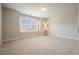 Bright bedroom features neutral walls, plush carpet, and a large window, creating a warm and inviting atmosphere at 622 Denali Dr, Mableton, GA 30126