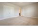 Neutral carpeted bedroom with an entry and closet, offering a spacious and adaptable design at 622 Denali Dr, Mableton, GA 30126