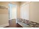 Welcoming entryway featuring a built-in bench and coat hooks, providing a practical mudroom area at 622 Denali Dr, Mableton, GA 30126