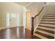 Inviting foyer with hardwood floors, staircase, and natural light from front door windows at 622 Denali Dr, Mableton, GA 30126