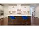 Modern kitchen with island, white cabinets, stainless steel appliances, and pendant lighting at 622 Denali Dr, Mableton, GA 30126
