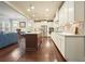 Bright, open-concept kitchen with island, stainless steel appliances, and hardwood flooring at 622 Denali Dr, Mableton, GA 30126