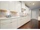 Modern kitchen with white cabinets, stylish backsplash, and plenty of counter space at 622 Denali Dr, Mableton, GA 30126