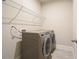 Practical laundry room area with new washer and dryer hookups and wire shelving at 622 Denali Dr, Mableton, GA 30126