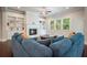 Spacious living room with fireplace, ceiling fan, built-in bookshelves, and large windows at 622 Denali Dr, Mableton, GA 30126