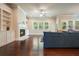 Bright and airy living room with fireplace, ceiling fan and natural light from the large windows at 622 Denali Dr, Mableton, GA 30126