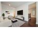Living room with modern furniture, accent rug, and television at 622 Denali Dr, Mableton, GA 30126