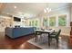 Open-concept space features a dining area with a view of the living room and built-in shelving at 622 Denali Dr, Mableton, GA 30126