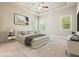 Relaxing main bedroom with tray ceiling, ceiling fan, natural light, and neutral tones at 622 Denali Dr, Mableton, GA 30126
