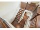 Staircase with stained wood treads, white risers, and metal balusters at 622 Denali Dr, Mableton, GA 30126