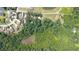 Aerial view of neighborhood showing wooded lots and pond at 3561 Stone Dr, Marietta, GA 30062