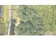 Aerial view of property showing home placement within wooded surroundings and defined property lines at 3561 Stone Dr, Marietta, GA 30062