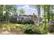 Large backyard featuring mature trees, lush greenery, and an expansive deck at 3561 Stone Dr, Marietta, GA 30062
