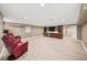 Finished basement with recessed lighting, built-in shelving, and two red leather recliners at 3561 Stone Dr, Marietta, GA 30062