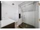 Modern bathroom features a glass-enclosed shower with white subway tile and a sleek vanity at 3561 Stone Dr, Marietta, GA 30062
