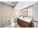 Bathroom with wood vanity, white countertop, modern lighting, and neutral color scheme at 3561 Stone Dr, Marietta, GA 30062