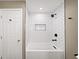 Bathroom with stylish shower featuring white subway tiles and black fixtures at 3561 Stone Dr, Marietta, GA 30062