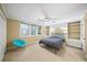 Bright bedroom with built-in shelving and a modern ceiling fan, carpeted floor at 3561 Stone Dr, Marietta, GA 30062