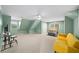Bedroom with green walls, carpeted floors, a queen bed, and a yellow sofa at 3561 Stone Dr, Marietta, GA 30062