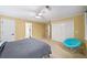 Bedroom with neutral carpeting, ceiling fan, and a large closet, good natural light at 3561 Stone Dr, Marietta, GA 30062
