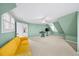 Bedroom with green walls, carpeted floors, a yellow sofa and many windows at 3561 Stone Dr, Marietta, GA 30062