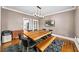 Dining room with a wooden table, chairs, bench seating and hardwood floors at 3561 Stone Dr, Marietta, GA 30062