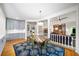 Dining room showcasing a table with seating, hardwood floors, and view into the living spaces at 3561 Stone Dr, Marietta, GA 30062