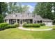 Charming home with a manicured lawn, inviting front porch, and a two-car garage at 3561 Stone Dr, Marietta, GA 30062