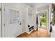 This foyer features wood floors, a coat closet, a door to the outside, and a storm door at 3561 Stone Dr, Marietta, GA 30062
